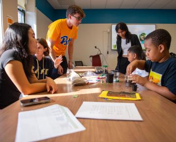 pitt student tutors and hill district youth engage in a STEAM Saturdays activity